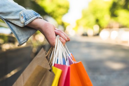 woman-holding-shopping-bags-hand